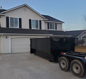 A photo of a dumpster delivery in progress.
